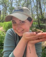 Profile picture of KU EEB graduate student, Taylor Michael, holding a frog